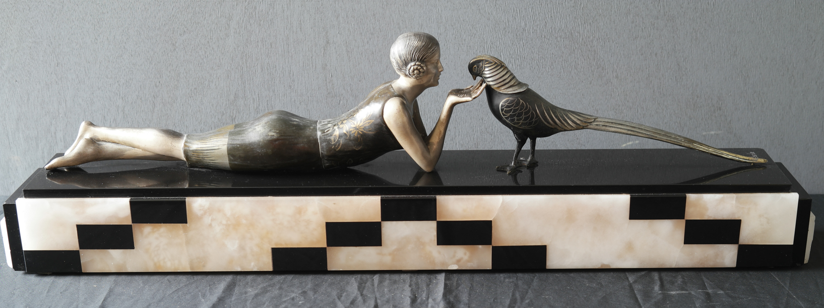 girl feeding bird sculpture kl 1